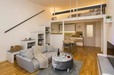 a kitchen with a wooden table and chairs at Chic Flat on Jecna Walk to Wenceslas Sq and Museum in Prague