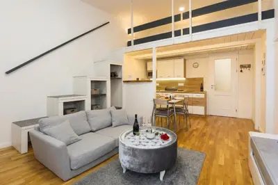 a kitchen and dining room with a table and chairs at Chic Flat on Jecna Walk to Wenceslas Sq and Museum in Prague