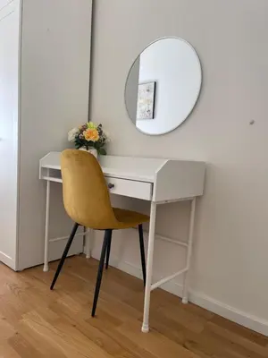 a white desk with a mirror and a yellow chair at Prague 1 Center Elegant 2BR Apartment with Panoramic Museum View and King Bed in Prague