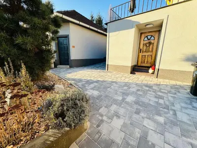 a driveway leading to a house with a door at Apartmán v klidné části Benešova in Benešov