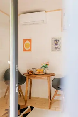 a small table in a room with two chairs at Buňka Poteplí in Horní Bezděkov