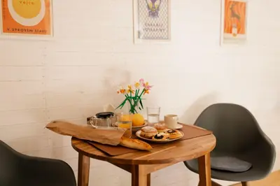 a table with a plate of food on it at Buňka Poteplí in Horní Bezděkov