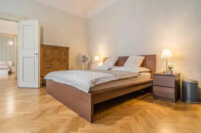 a bedroom with a large bed in a room at Luxury Karmelitska 2B apartment in Prague