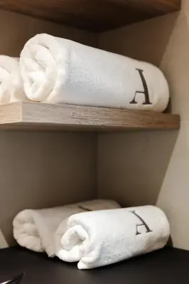 a bathroom with a washing machine and a mirror at Avenue Apartments in Prague