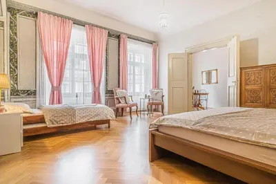 a bedroom with two beds and a table and chairs at 2 Bed Flat - Sleeps 6 - Pets - Wifi in Prague