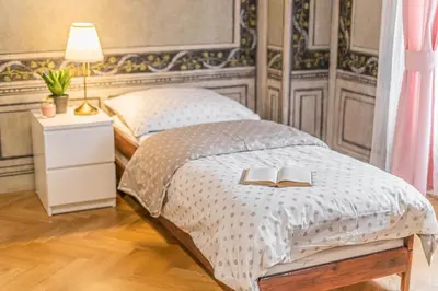 a bedroom with a bed with two books on it at 2 Bed Flat - Sleeps 6 - Pets - Wifi in Prague