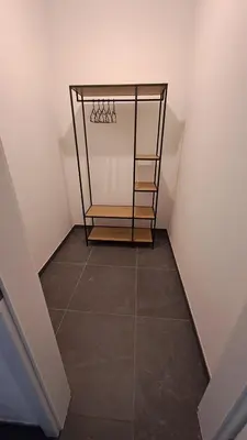 a walkway with a basketball hoop in a room at Apartmán u letiště in Tuchoměřice