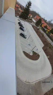 an aerial view of a parking lot with cars parked at Apartmán u letiště in Tuchoměřice