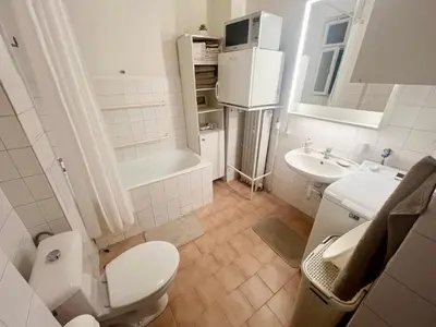 a bathroom with a toilet and a sink at Cozy private apartment in Prague