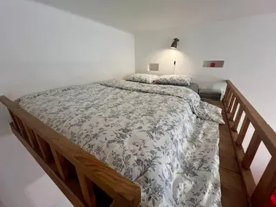 a bedroom with a large bed in a room at Cozy private apartment in Prague