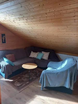 a living room with a couch and a table at U Dobroty in Nový Dŭm
