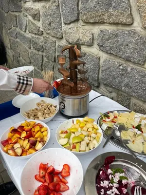 a table topped with plates of food and bowls of fruit at Marina Hubenov in Hubenov