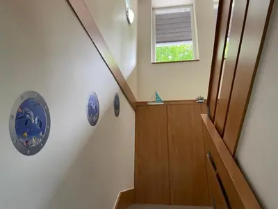 a staircase in a house with a stair case at Marina Hubenov in Hubenov