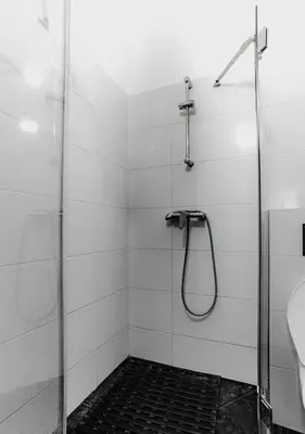 a bathroom with a shower and a sink at Hostel Karlin in Prague