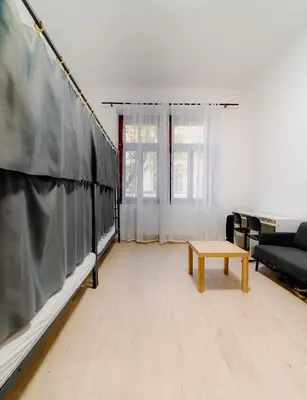 a living room with a couch and a table at Hostel Karlin in Prague