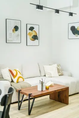 a living room with a couch and a coffee table at Rentero Wenceslas Square Apartments in Prague