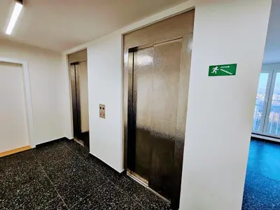 an elevator in a building with a sign on it at LIVE-INN PRAGUE DELUXE SUITE FOR 1-4 GUESTS, 20 Mins to center, Lift, Gym, Reception, Parking, Roof Terrace, Game & Party in Prague