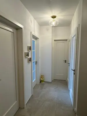 a kitchen with a counter and a table in a room at Apartmán Vinohradská 160 in Prague