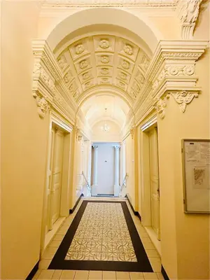 an empty hallway in a building with a ceiling at New Design apartment right next Wenceslas Square in Prague