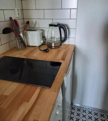 a kitchen with a counter top with a blender on it at Hezký apartman s balkonem in Prague