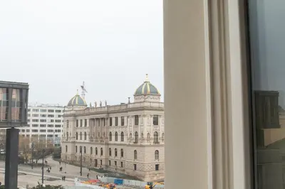 a view of a large building from a window at Cozy Retreat by Wenceslas Square in Prague