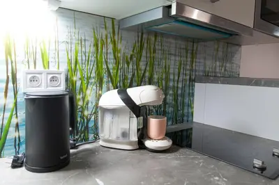 a kitchen counter with a coffee maker and a coffee maker at Cozy Retreat by Wenceslas Square in Prague