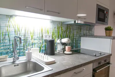 a kitchen with a sink and a counter top at Cozy Retreat by Wenceslas Square in Prague