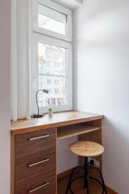 a kitchen with a desk and a window at All-in 2 Bedroom Family Apartment in Prague