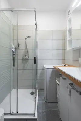 a shower with a glass door in a bathroom at All-in 2 Bedroom Family Apartment in Prague