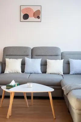 a living room with a couch and a coffee table at All-in 2 Bedroom Family Apartment in Prague