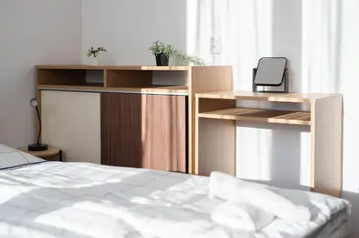 a bedroom with a bed and a desk with a phone at All-in 2 Bedroom Family Apartment in Prague
