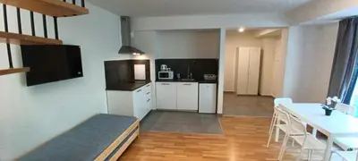a room with a kitchen and a dining room at Brand new two room apartment #25 in Elite residence close to center in Prague