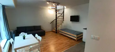 a living room with a couch and a table at Brand new two room apartment #25 in Elite residence close to center in Prague