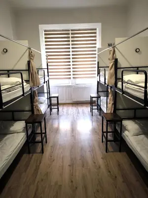 a room with four bunk beds and a window at Hostel Relax in Prague