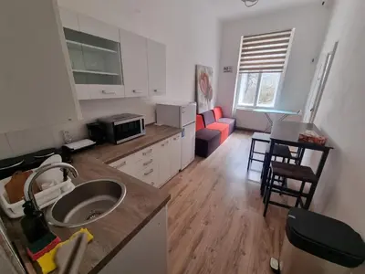 a kitchen with a sink and a counter top at Hostel Relax in Prague