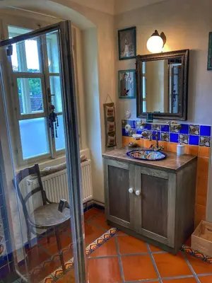 a bathroom with a sink and a mirror at Casa Mexico in Roztoky