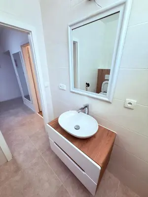 a bathroom with a sink and a mirror at Cosy Cave Station in Prague 5 in Prague