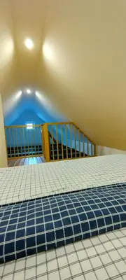 a small blue swimming pool in a room at Apartmány Křivoklát in Křivoklát