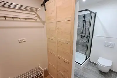 a bathroom with a shower and a toilet in it at Contemporary Zizkov Studio -001- in Prague