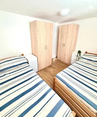 a room with wooden doors and signs on the wall at Sleep & Go Czech Republic - Velké Popovice in Velké Popovice