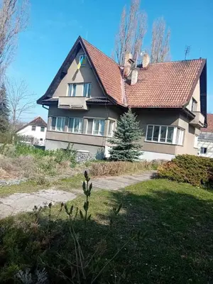 a large house with a red roof at Sleep & Go Czech Republic - Kralupy nad Vltavou in Mikovice
