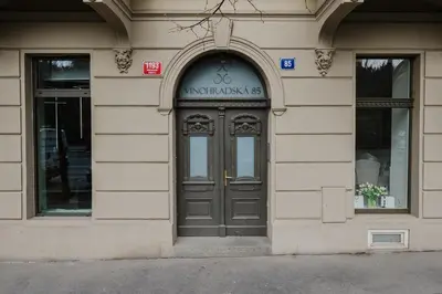 an entrance to a building with a door at Prague Days - Two-bedroom Apartment with Parking Space and 2 bathrooms in Vinohrady in Prague