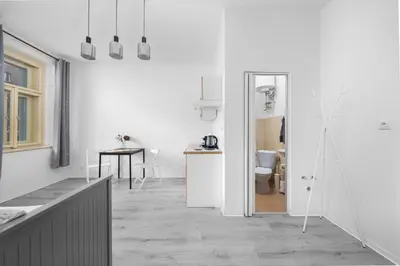 a door leading into a bedroom with a bed at Cozy Studio near City in Prague