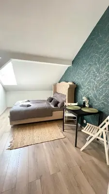 a door leading into a room with a table at Cozy Studio near City in Prague