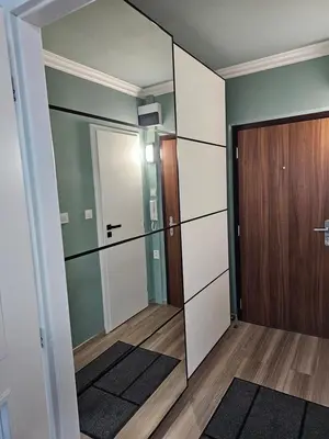 a room with a mirror and a door at Westfield apartment in Prague