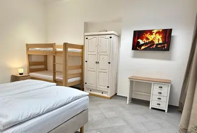 a bedroom with a bed and a bunk bed at Sleep & Go Czech Republic - Praha 5 Anděl in Prague