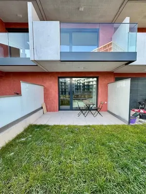a house with a balcony and a grass yard at Centrum Park District in Prague