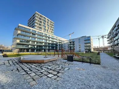 a playground in front of a large building at Centrum Park District in Prague