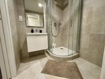 a bathroom with a shower and a sink at Centrum Park District in Prague