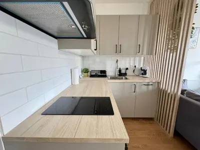 a kitchen with a wooden counter top in a room at Centrum Park District in Prague